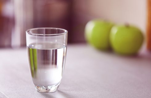 Glass of pure water on kitchen table