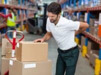 Focus of worker having a backache