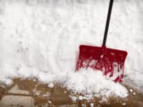 Snow shovel in a snow bank