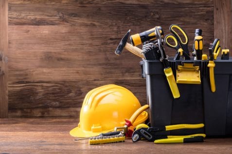 Safety helmet with tools in the black container