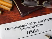 Occupational Safety and Health Administration  OSHA  and a book.