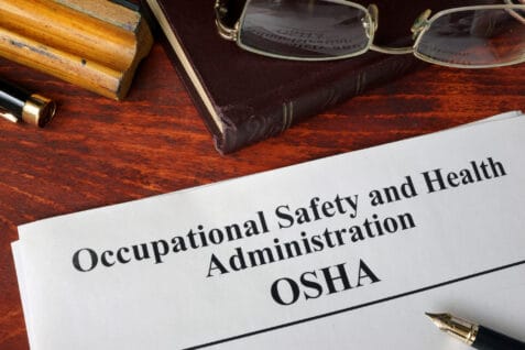 Occupational Safety And Health Administration Osha And A Book.