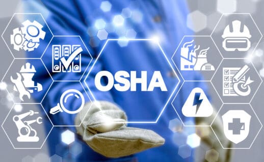 Industrial manager uses on a virtual screen of the future and sees the acronym: osha. osha occupational safety and health administration industry concept.