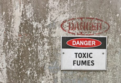 Red, black and white danger, toxic fumes warning sign