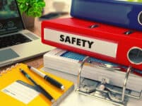 Red office folder with inscription safety.