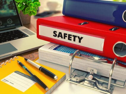 Red office folder with inscription safety.