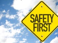 Safety first sign with sky background
