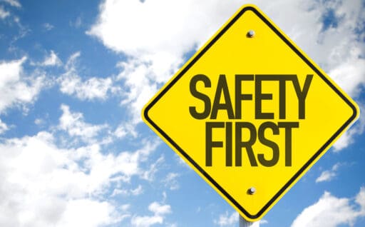 Safety first sign with sky background