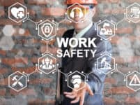 Work Safety First Standard Сonstruction Industry Business Concept. Health protection, personal security people on job, hazards, regulations. Man in helmet presenting work safety icon on virtual screen