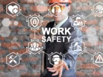 Work safety first standard Сonstruction industry business concept. health protection, personal security people on job, hazards, regulations. man in helmet presenting work safety icon on virtual screen