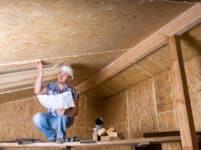 Builder Reading Plans Inside Unfinished Home