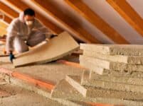 Man Laying Thermal Insulation