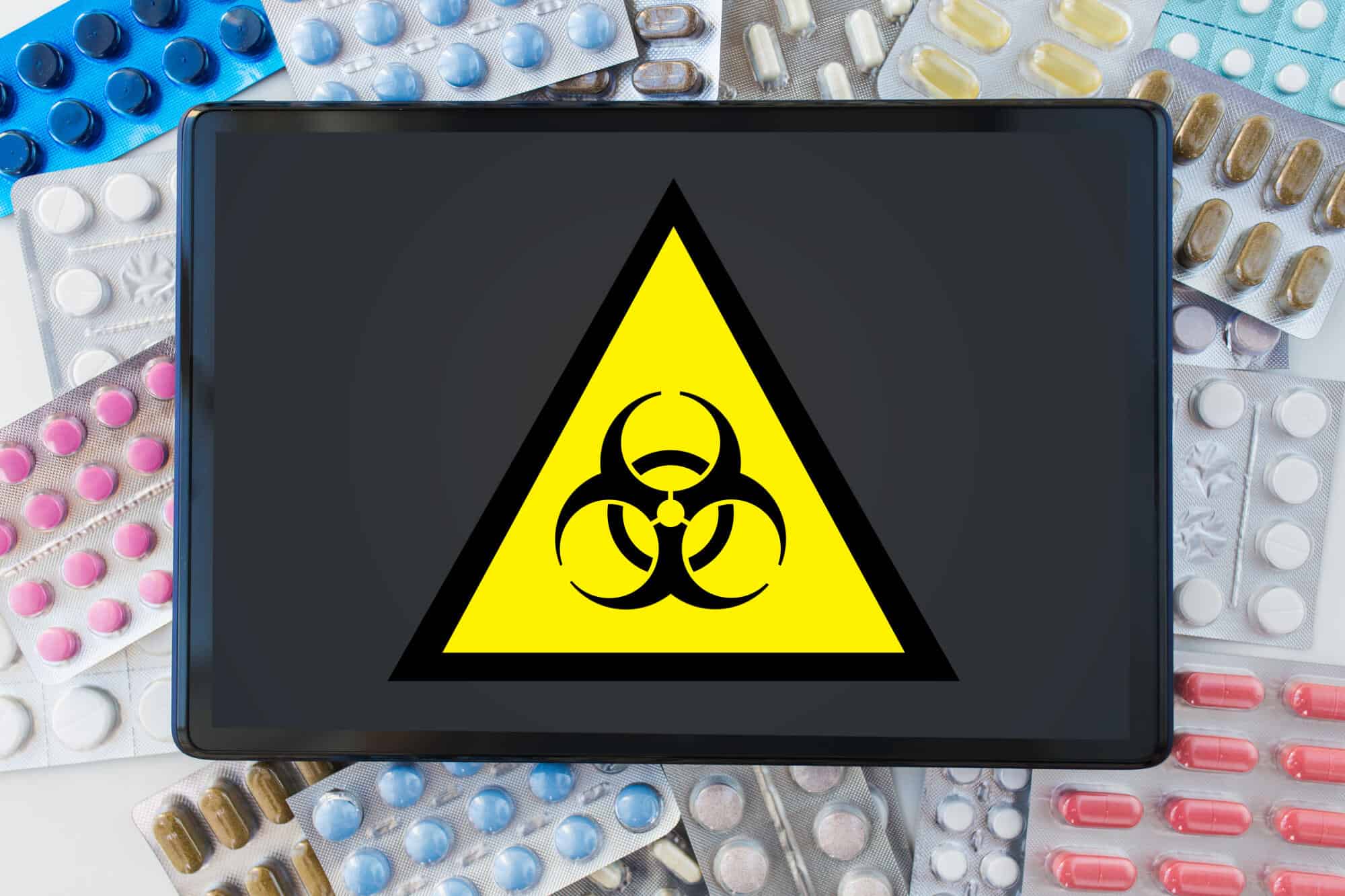 Medicine,,epidemic,and,healthcare,concept, ,boihazard,caution,sign,,tablet