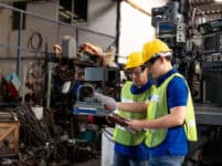 Factory,Male,Worker,Discussing,And,Looking,Clipboard,Document,For,Maintenance