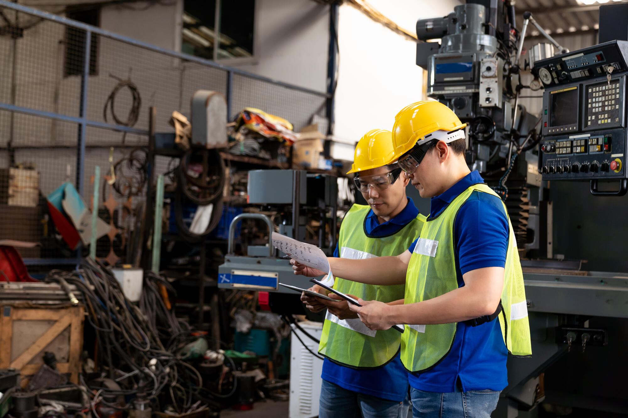 Factory,Male,Worker,Discussing,And,Looking,Clipboard,Document,For,Maintenance